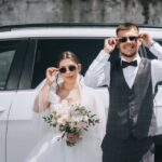 A,Stylish,Groom,In,A,Gray,Suit,And,A,Bride
