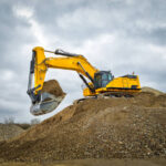 Excavator blue sky heavy machine construction site