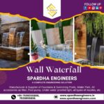 Elegant wall waterfall fountain with glass panel and smooth sheet water flow for modern interior decor