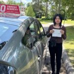 Student learning safe driving skills at a professional driving school in Waterloo with instructor guidance for G2 and BDE course training