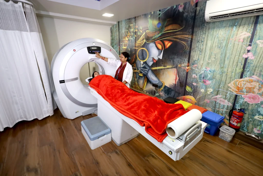 Patient undergoing CT Scan in Gurugram at a modern diagnostic lab with technician operating the scanning machine