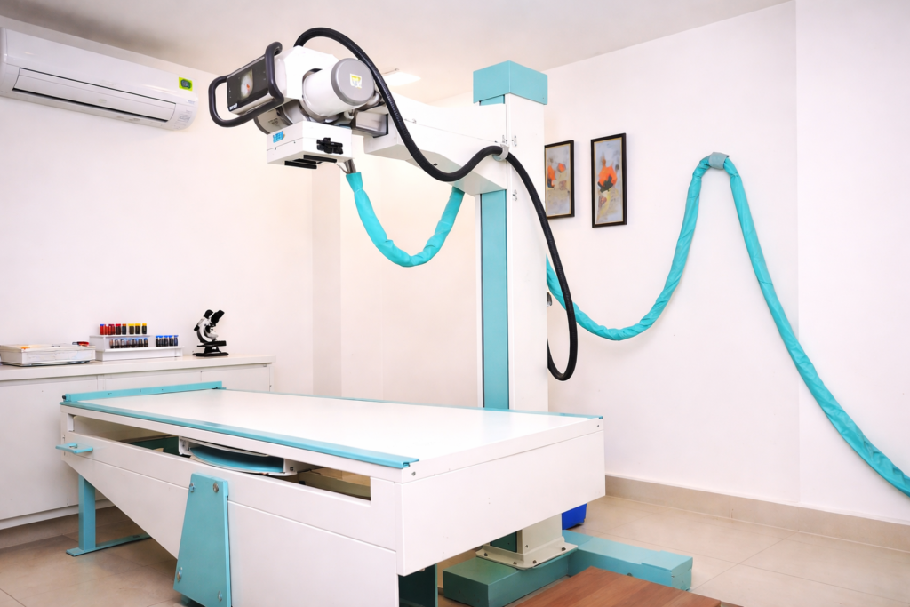 Modern X-ray room in a pathology lab with advanced digital radiology machine and patient examination table