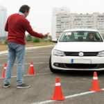 Student learning safe driving techniques during a driving course in Cambridge with a certified instructor from Yo Driving Academy.