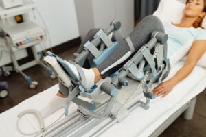 closeup-woman-physical-rehabilitation-with-arthromot-device_637285-9457