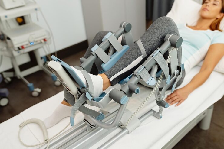closeup-woman-physical-rehabilitation-with-arthromot-device_637285-9457