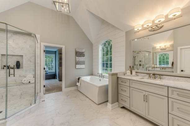 Soaking tub near a decorative window