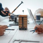 Architectural Design Services Team Reviewing Building Model