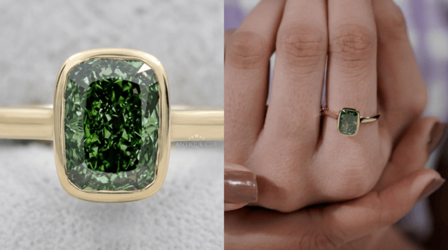 Rectangular green lab grown diamond ring with a yellow gold bezel setting displayed close-up and worn on a hand.