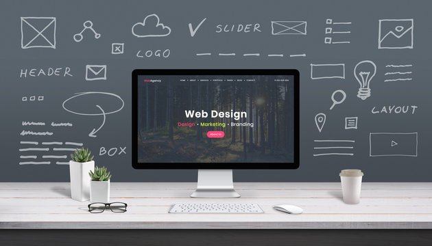 A computer screen displaying a website layout surrounded by wireframe sketches representing comprehensive web design and development services.