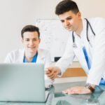doctors-looking-laptop-90kb