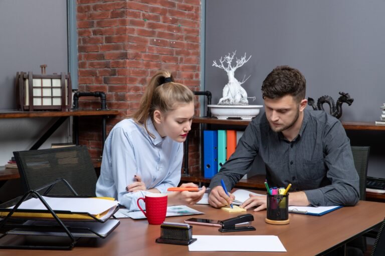front-view-young-motivated-hardworking-office-team-focused-one-issue-office-enviroment (1) (1)