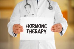 Doctor holding a white paper, Hormone Theraphy written on paper.