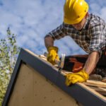 Caucasian Professional Roof Contractor and His Job. Roofing Theme.